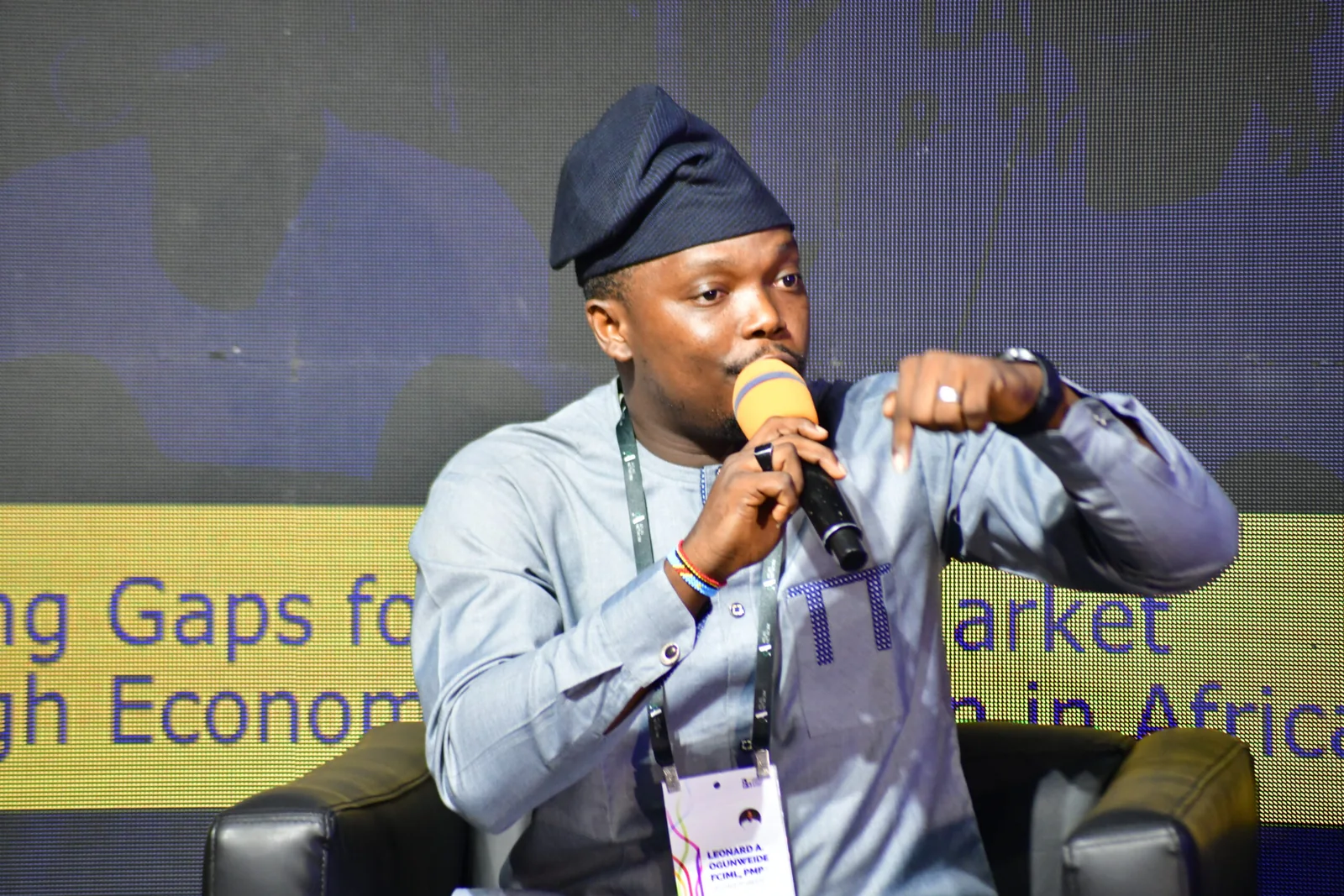 Institution builder speaking during a public event